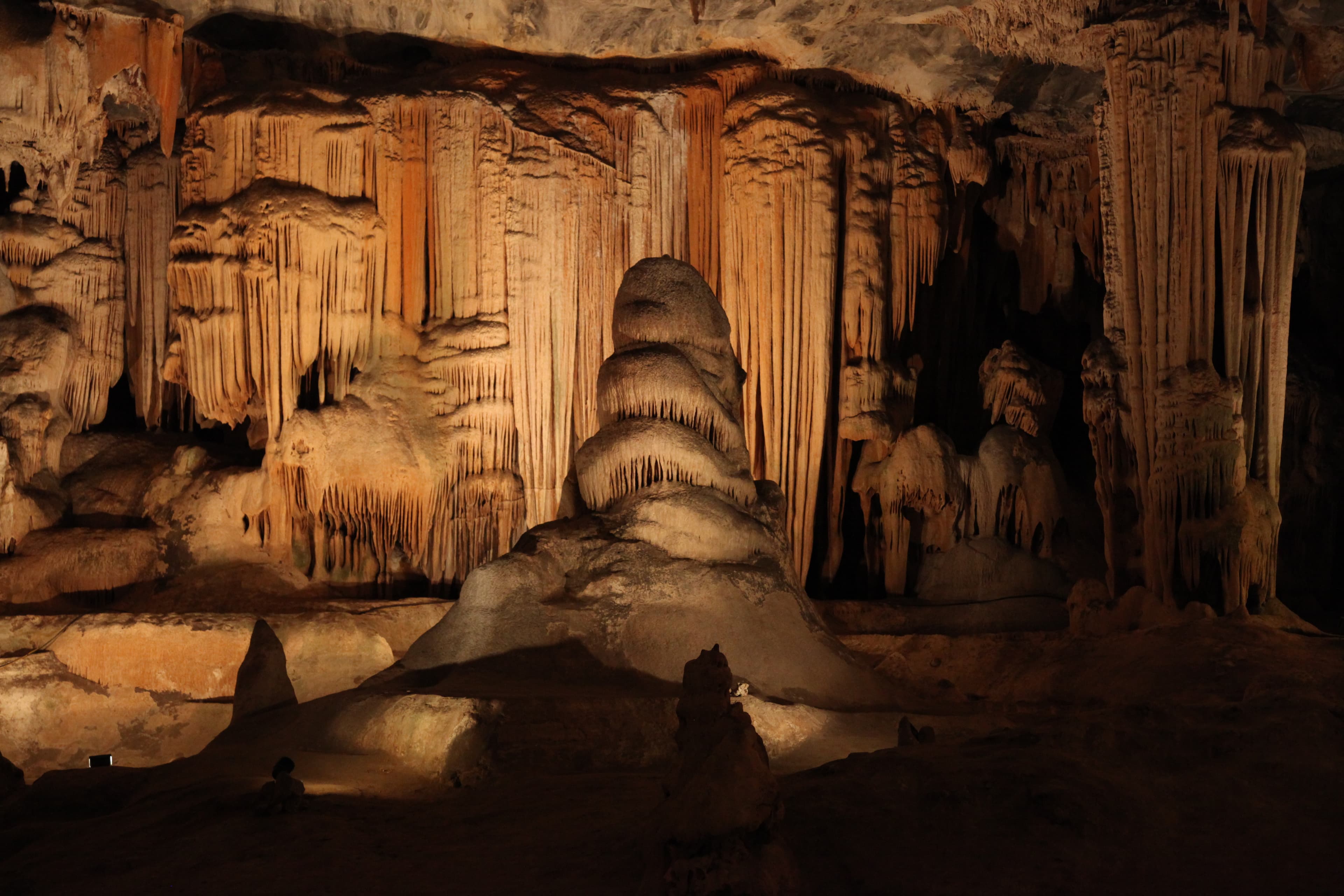 Illuminated limestone formations inside the Cango Caves